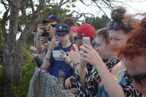 Children taking photos with their phones