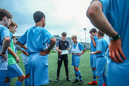 City Football Schools Tactical Huddle - City football development tours - Manchester