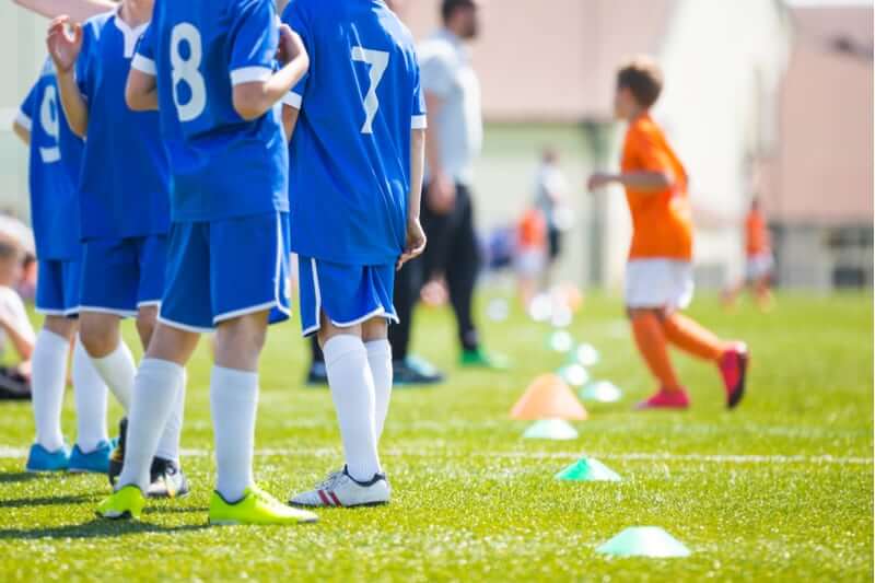 Children playing football at school